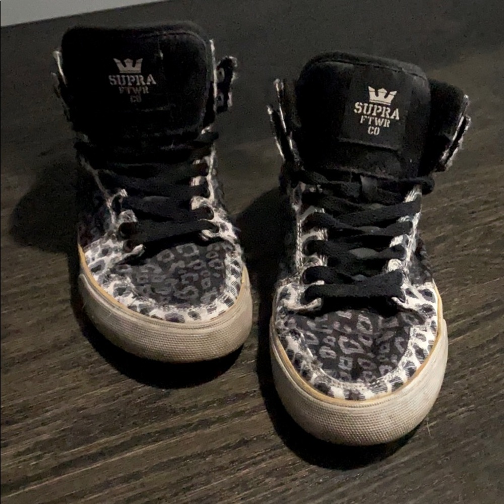 White and black Supra High Tops